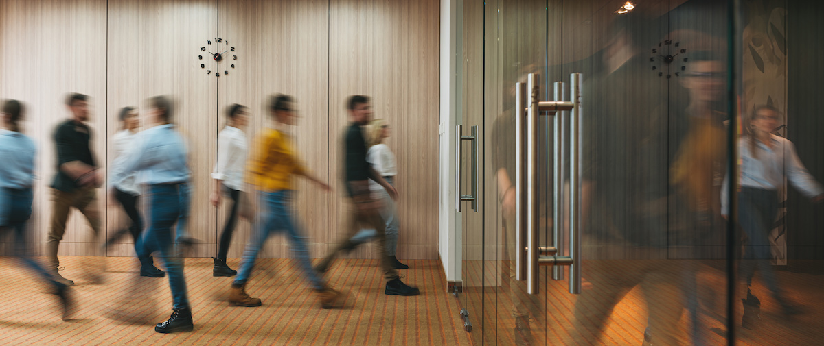 Blurry photo of people walking into office